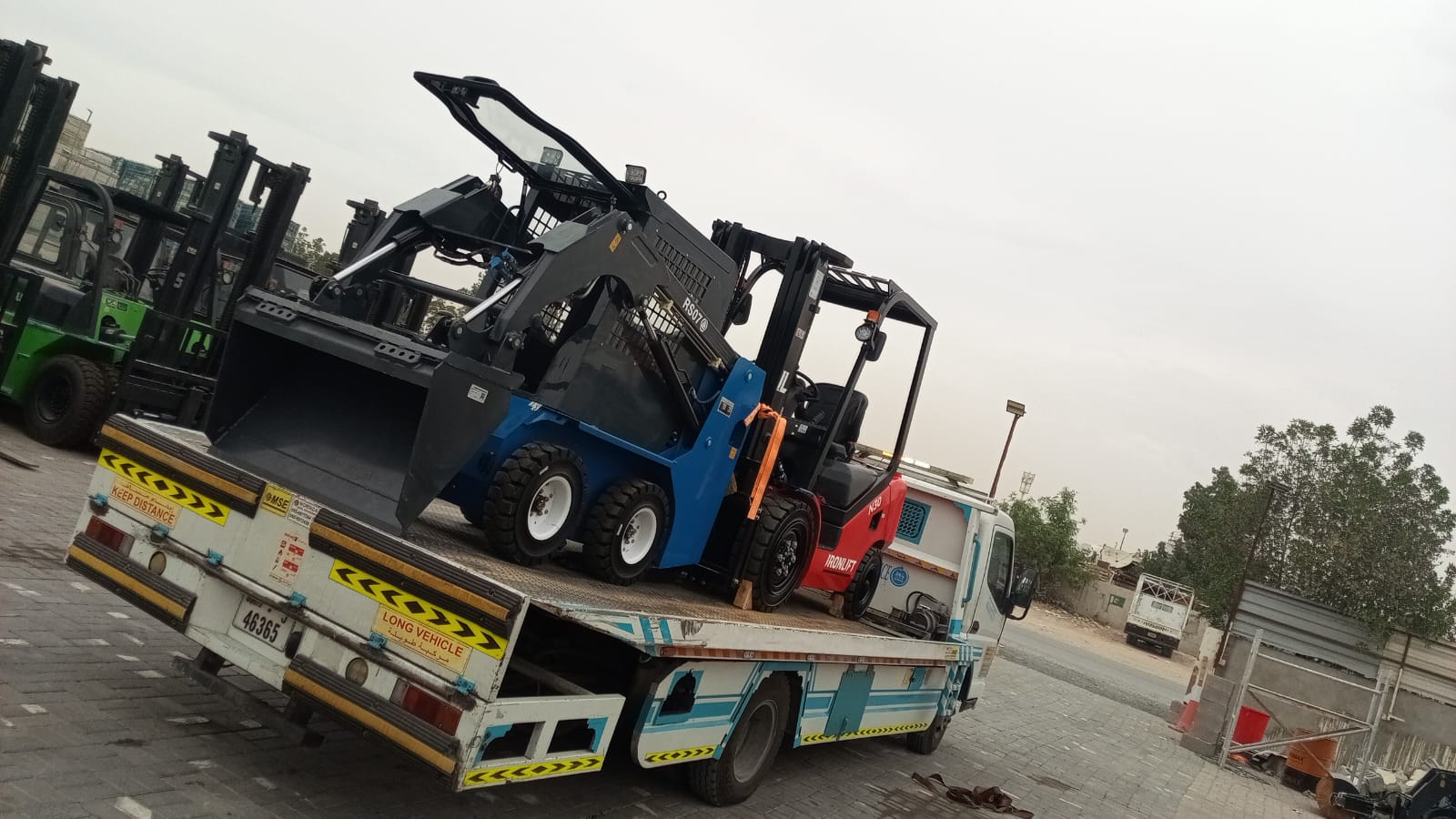 Irfan Recovery Sharjah transporting equipment on a flatbed